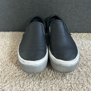 Vans Black and White Slip-On Sneakers